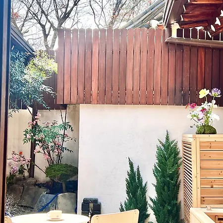 A Traditional Korean House With A Yard